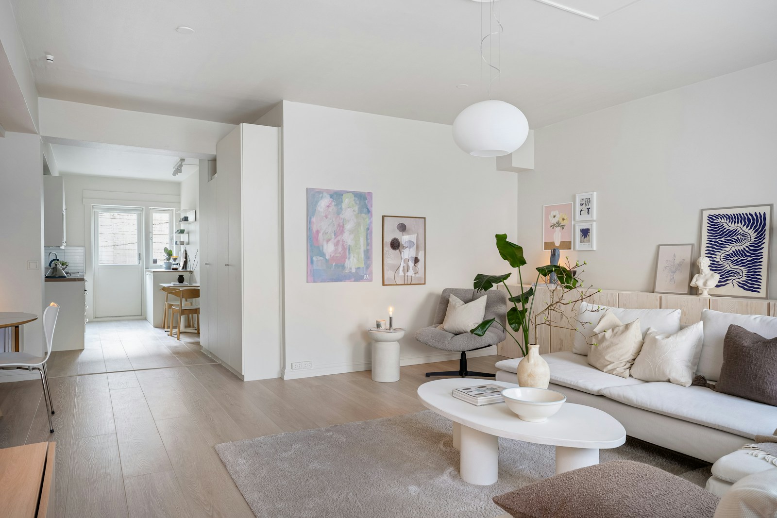 A bright living room with white walls and natural finishes